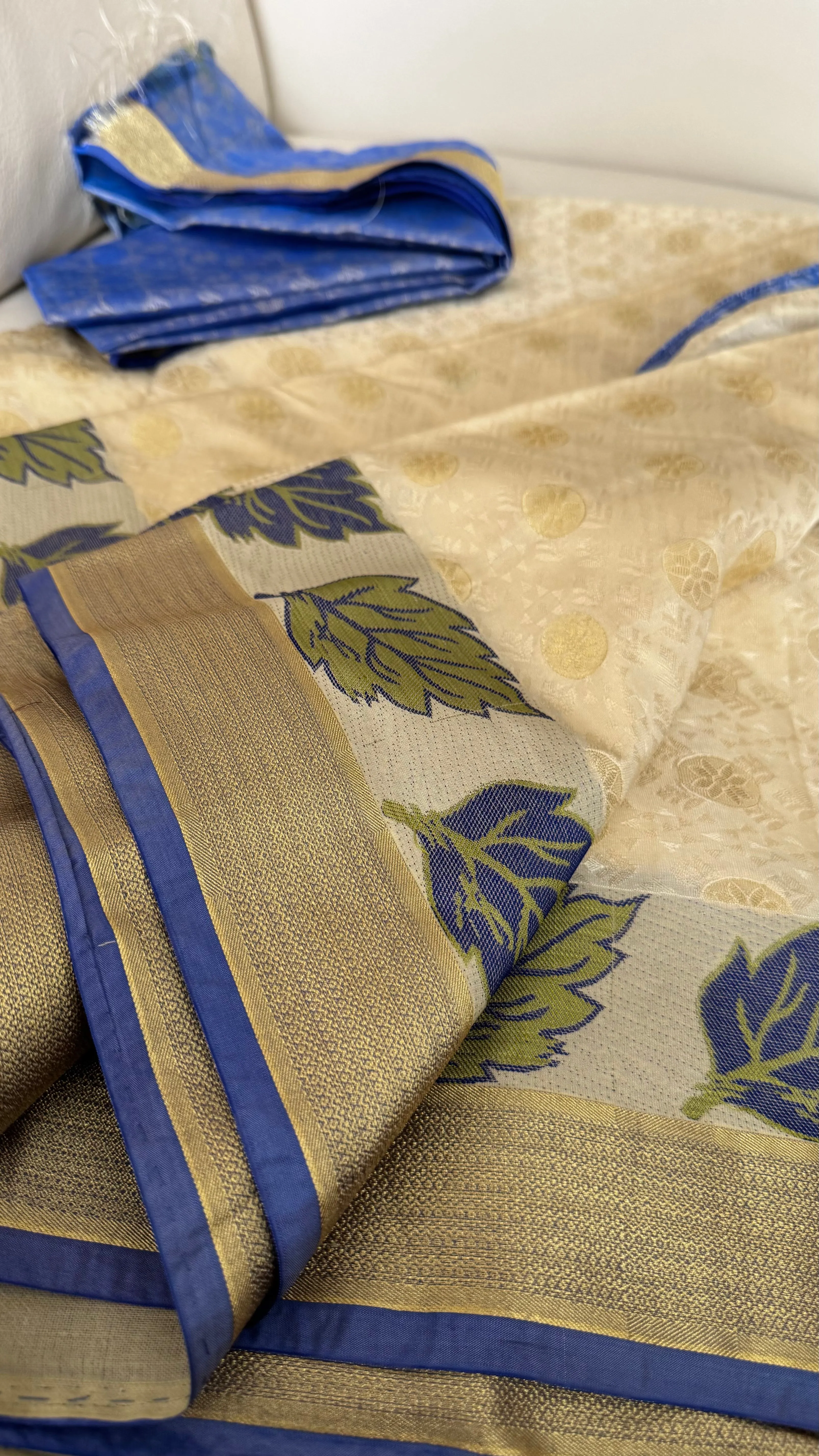 Blended Off White Floral Silk Saree with Blue